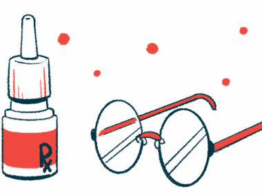 A bottle of eye drops sit next to a pair of eyeglasses.