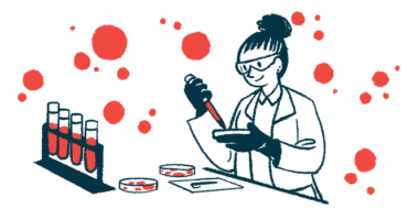 A scientist in a lab uses a petri dish and dropper to test blood, alongside a rack with four filled vials.